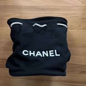 Chanel bucket bag   CC logo drawstring backpack.  Two tears inside exterior good